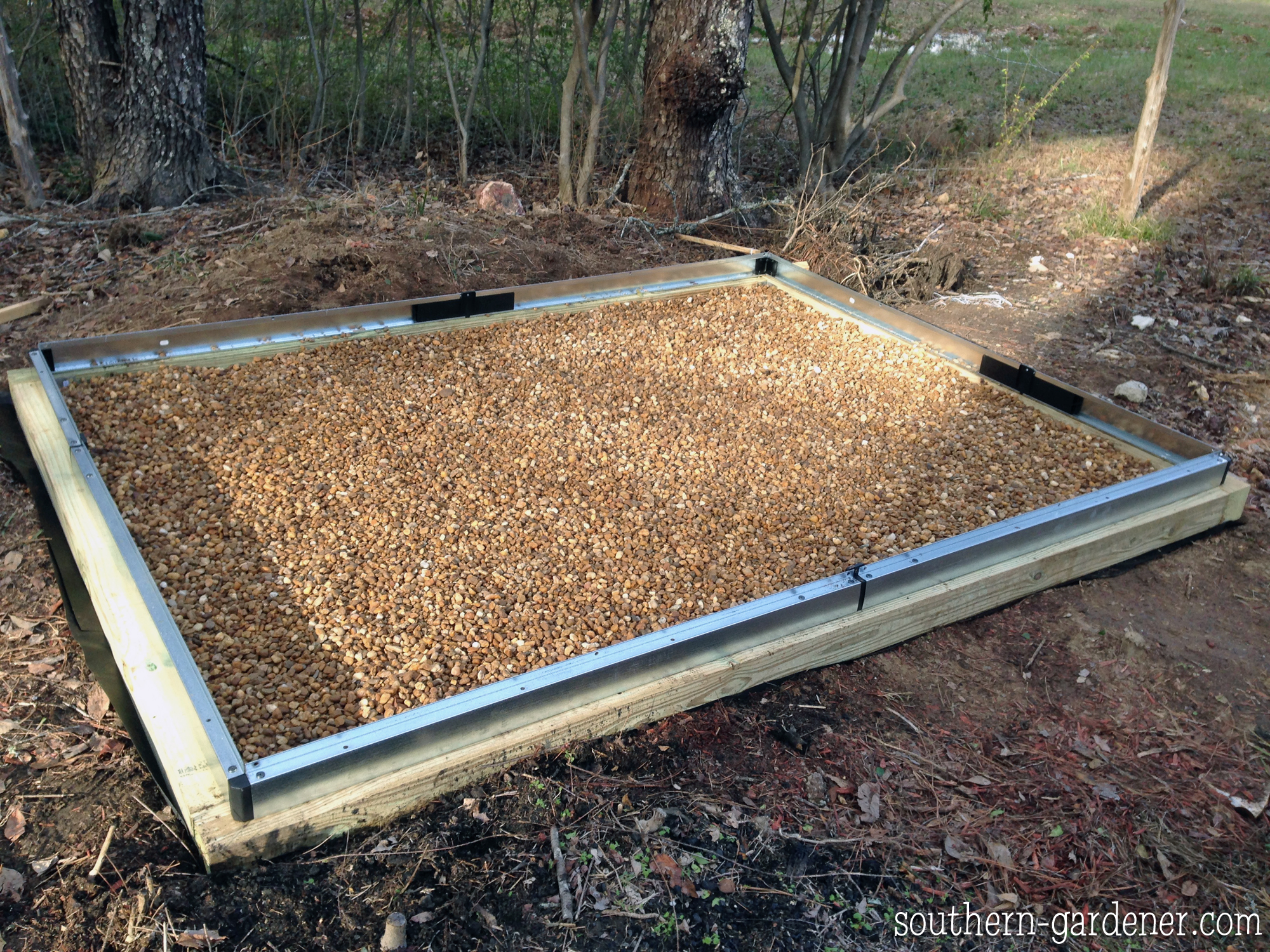 day 1: greenhouse base frame and pea gravel